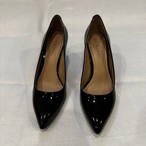 BCBGeneration Black patent leather pumps.